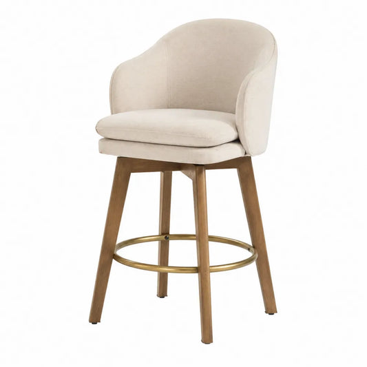 Krzesło barowe z beżowej tkaniny, drewniane nogi i złoty podnóżek